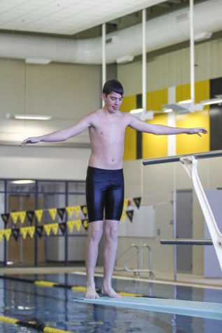 Jeremy Johnson prepares to dive during a competition on Dec. 10.