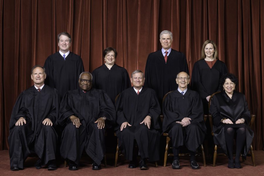 The Roberts Court, April 23, 2021  
Seated from left to right: Justices Samuel A. Alito, Jr. and Clarence Thomas, Chief Justice John G. Roberts, Jr., and Justices Stephen G. Breyer and Sonia Sotomayor  
Standing from left to right: Justices Brett M. Kavanaugh, Elena Kagan, Neil M. Gorsuch, and Amy Coney Barrett
