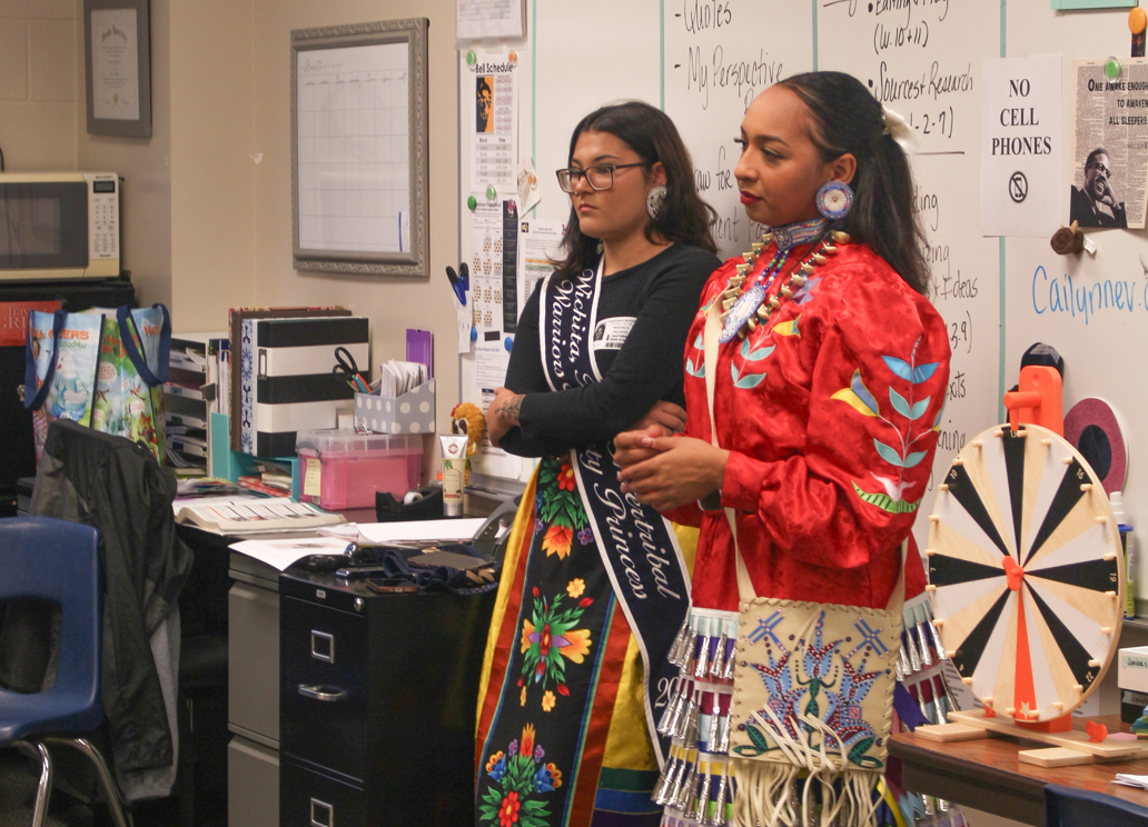 Intertribal Warrior Society Princess Mari Gallegos on the left and Apache Princess Amaya Harris on the right educating students on Native American culture.