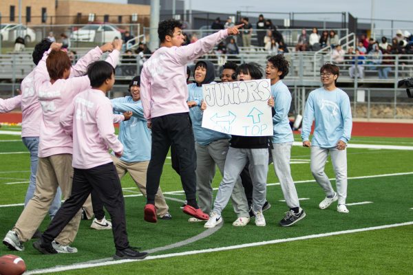 Junior and senior boys cheerleading at Powder Puff last year. 